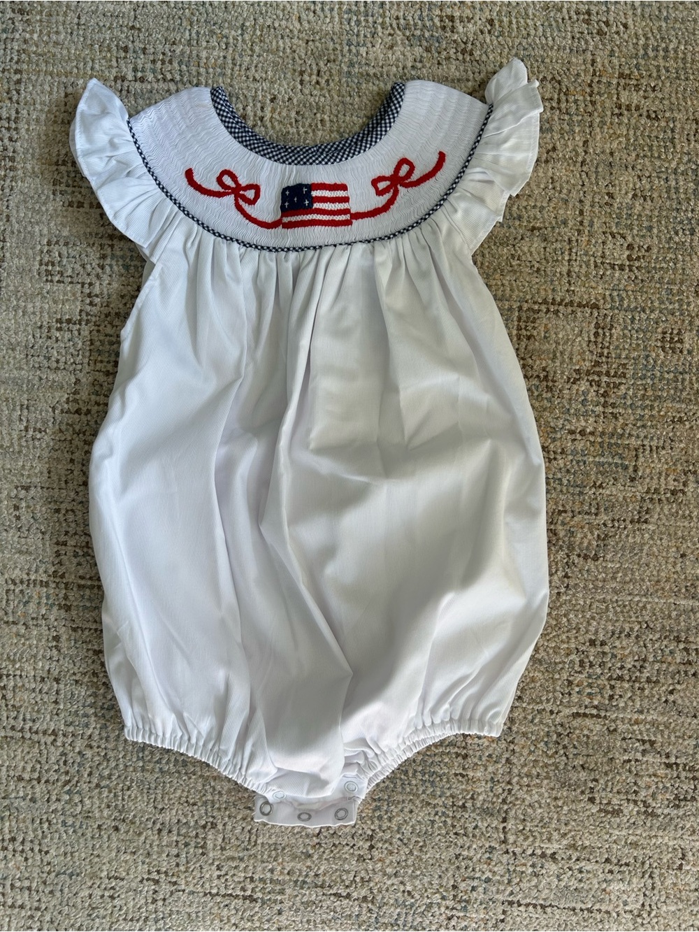 White Baby Smocked Romper with Red & Blue Flag Embroidery